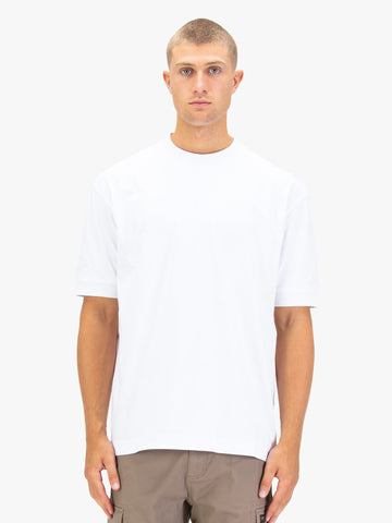 Men's relaxed-fit white t-shirt with crew neck and short sleeves, worn by a model, front view