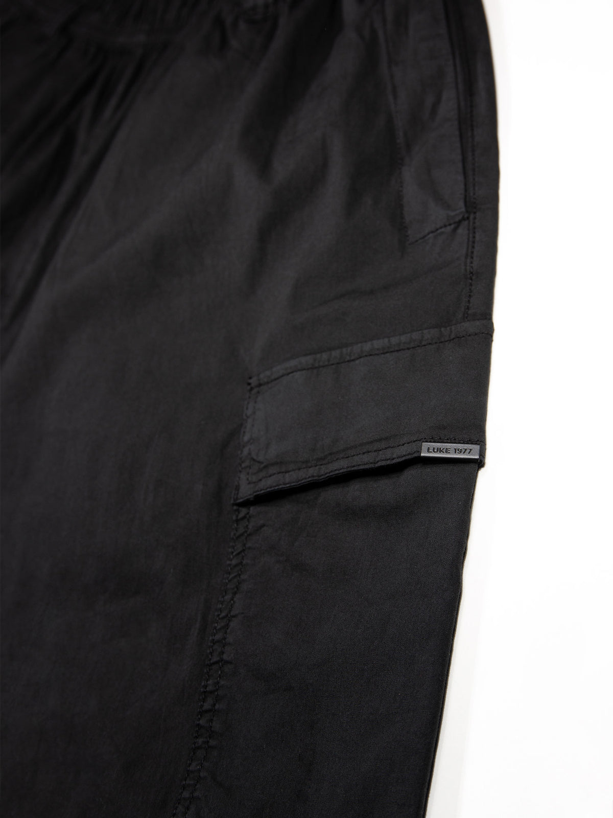Men's black cargo trousers with cargo pockets.