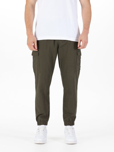 Men's green cargo trousers with cargo pockets.
