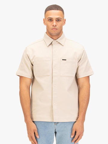 Men's beige shirt with button-up front.