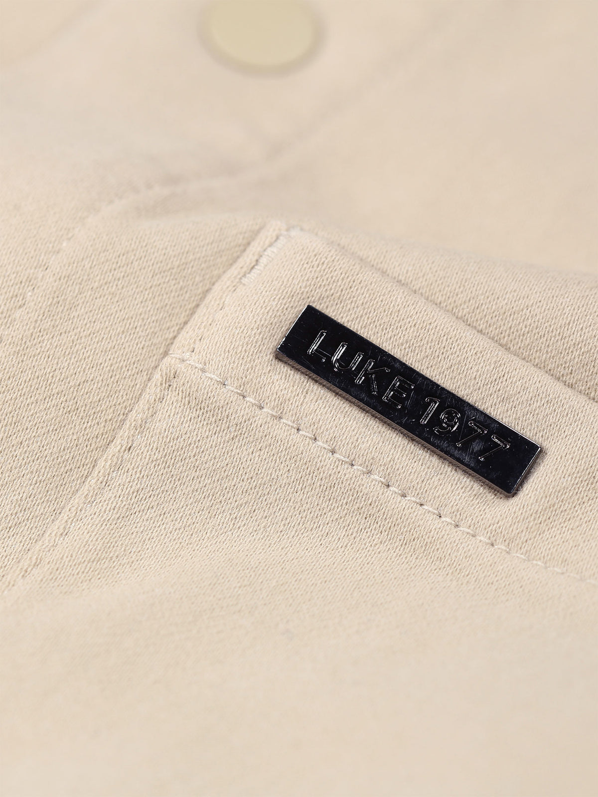 Men's beige shirt with button-up front.