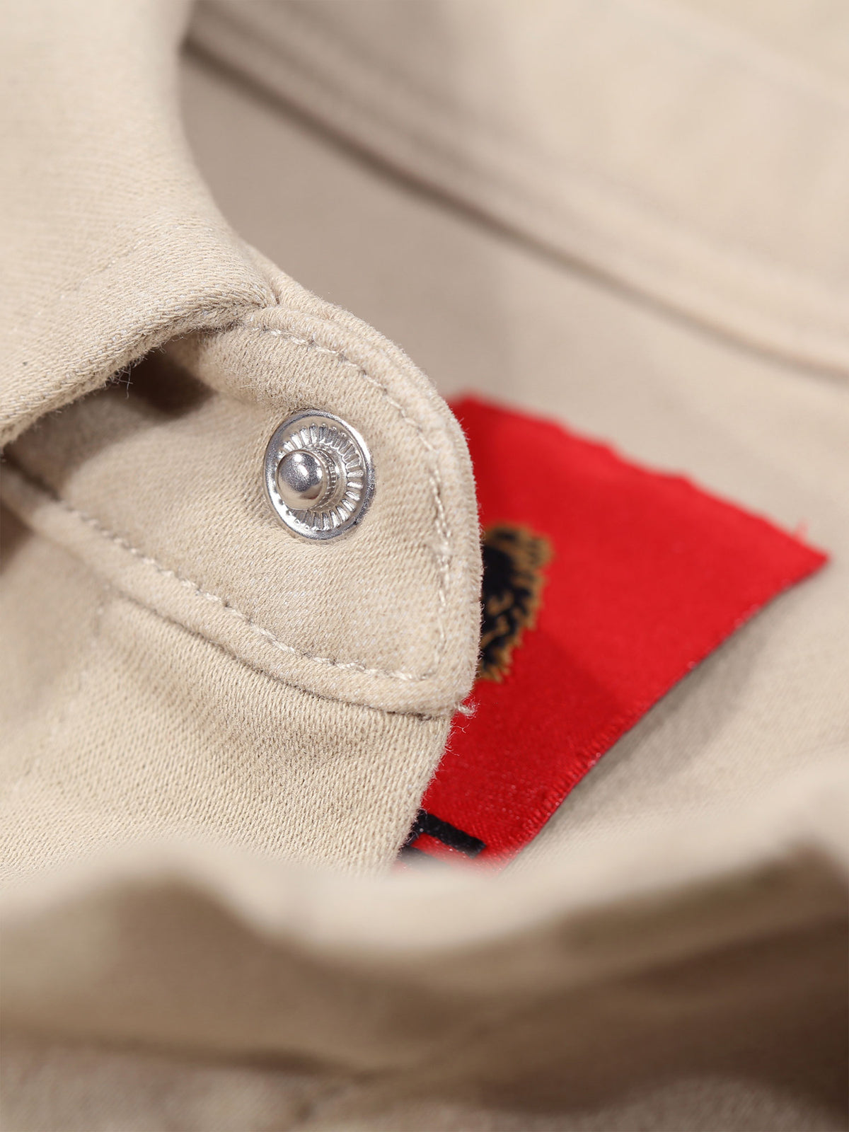 Men's beige shirt with button-up front.