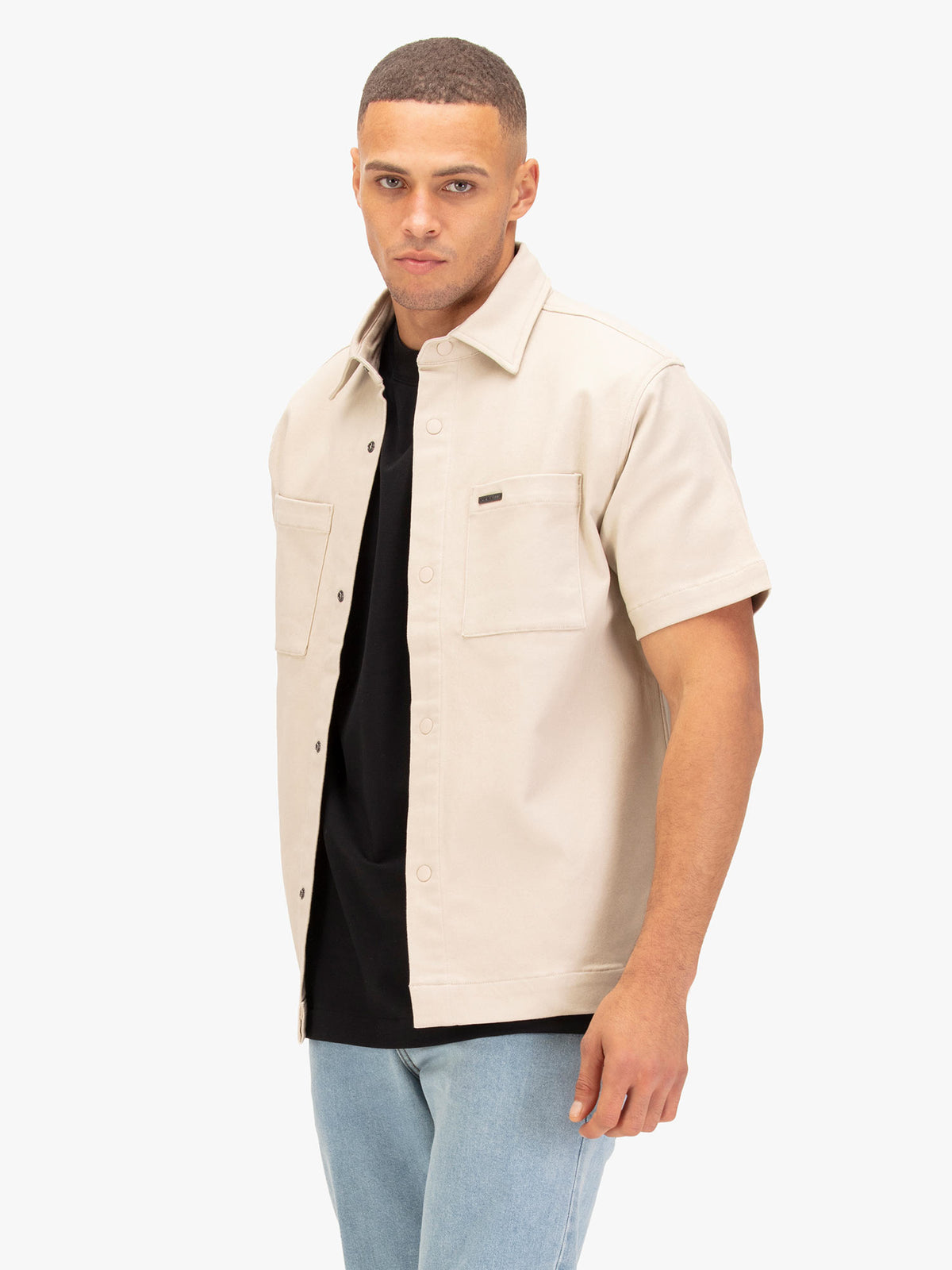 Men's beige shirt with button-up front.