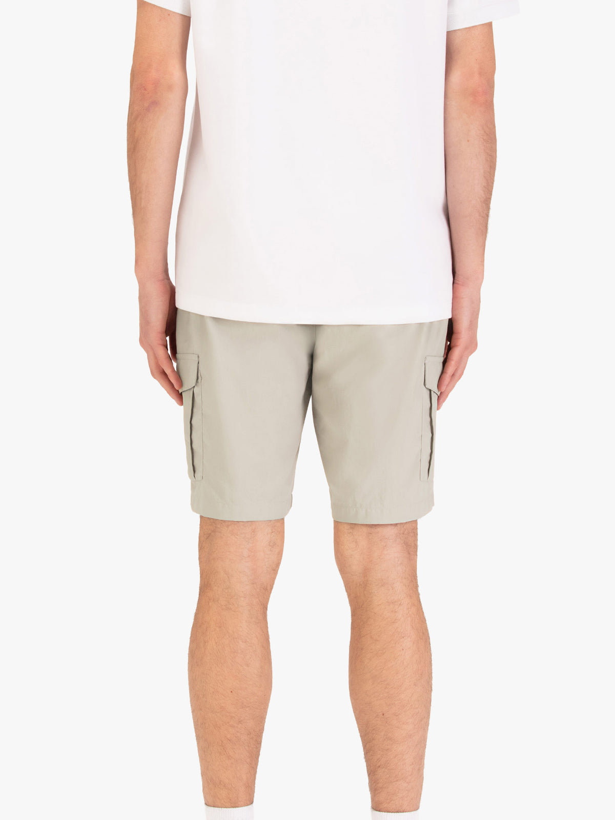 Men's beige shorts with elasticated waistband, worn by a model, back view