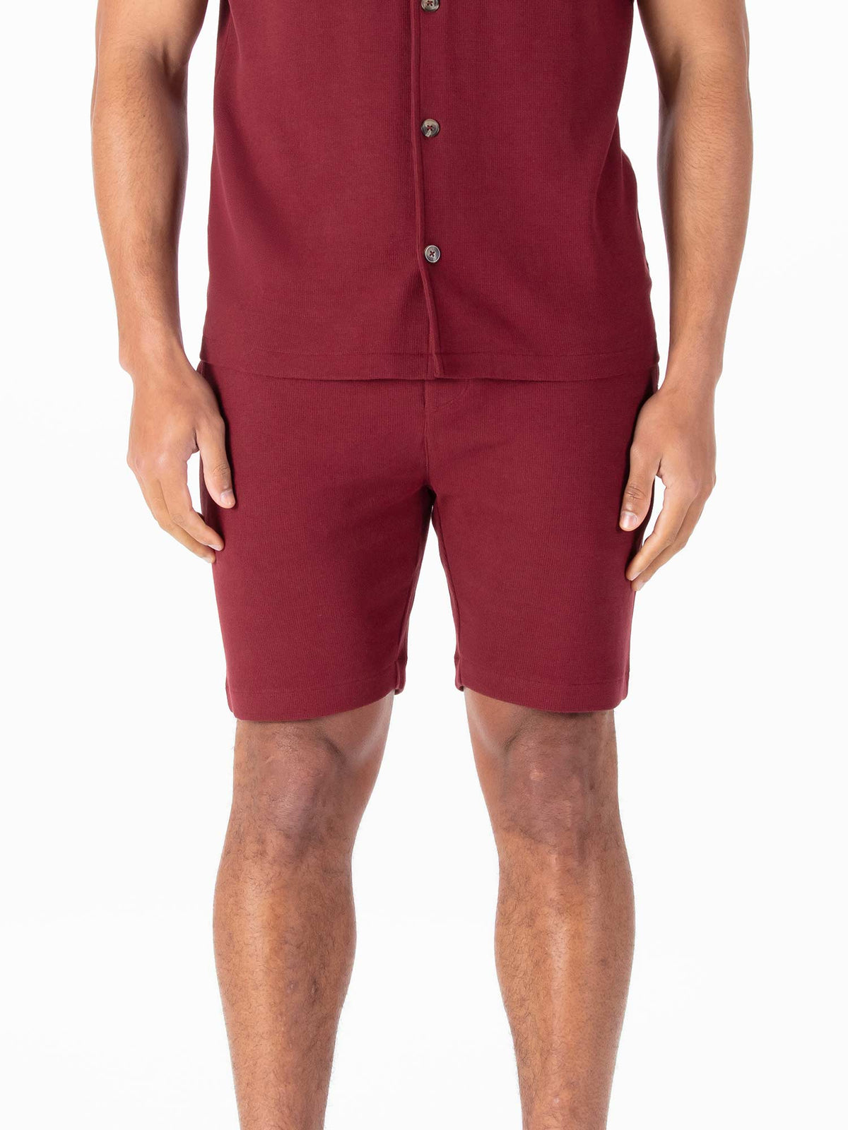 Men's red shorts with drawstring waistband.