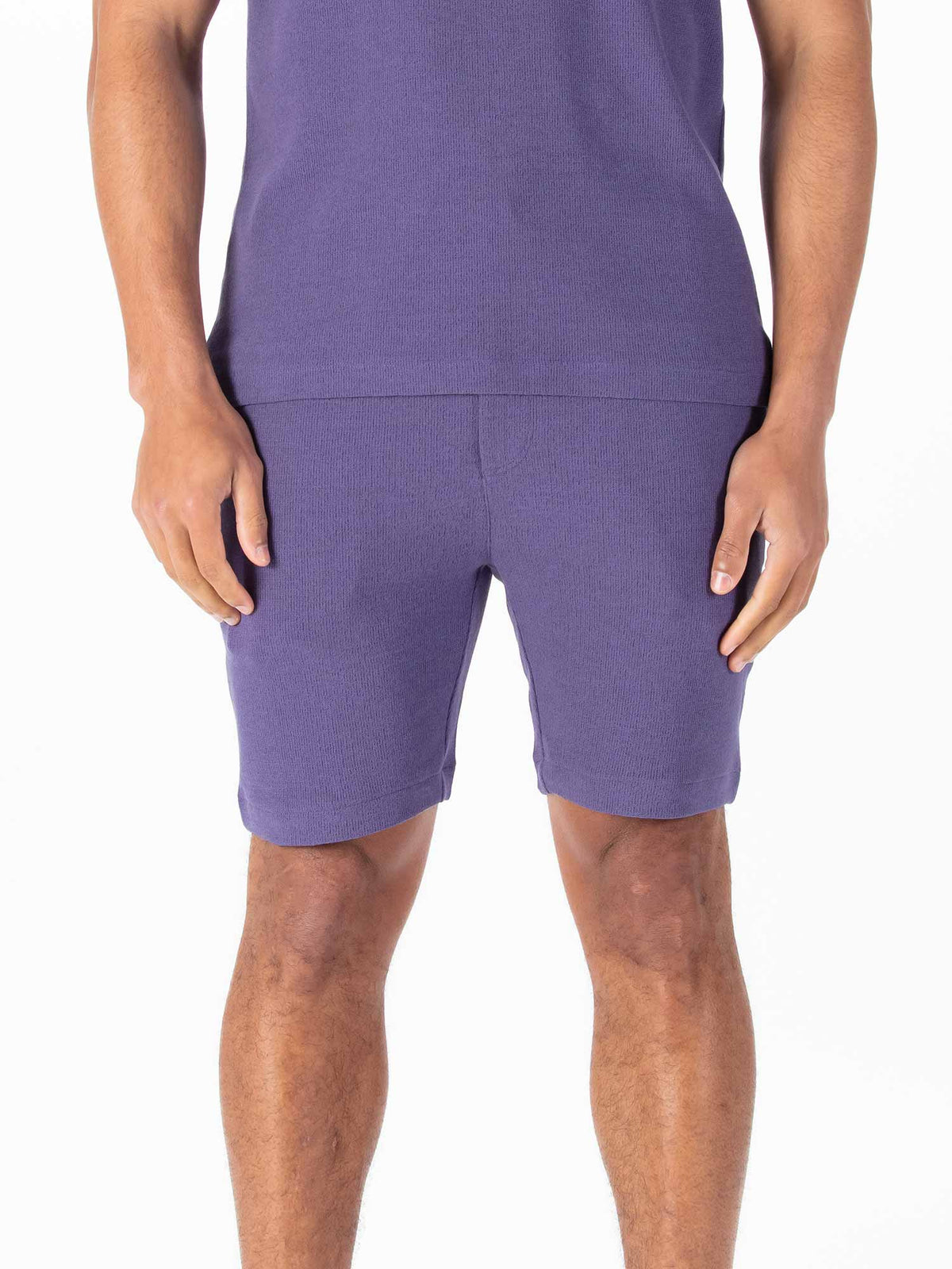 Men's purple shorts with drawstring waistband.