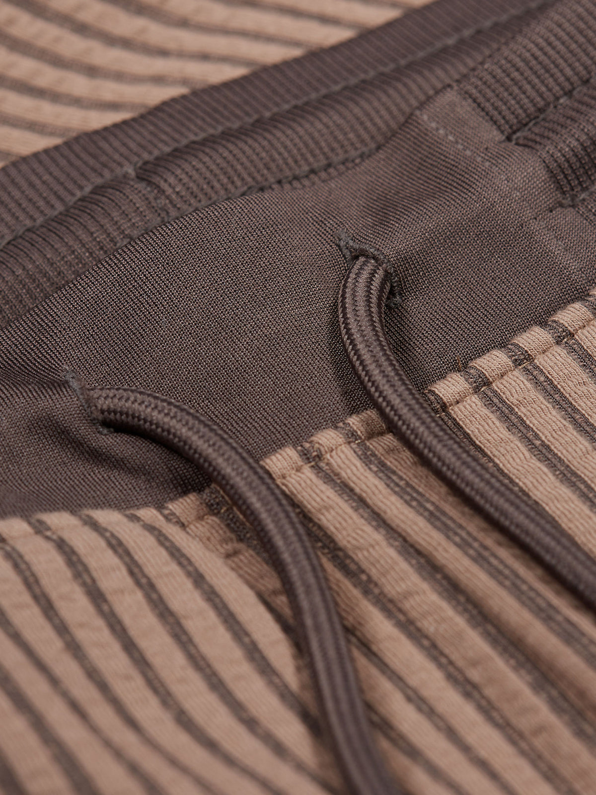 Men's brown shorts with drawstring waistband.