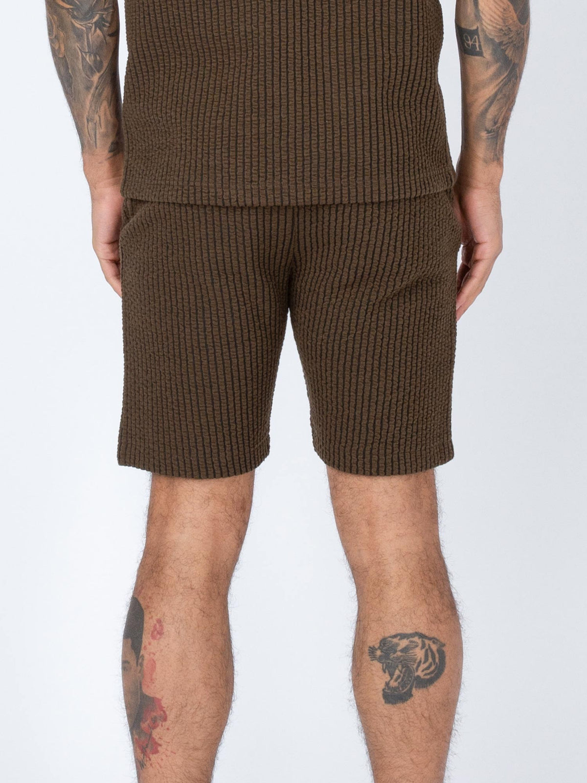 Men's brown shorts with drawstring waistband.