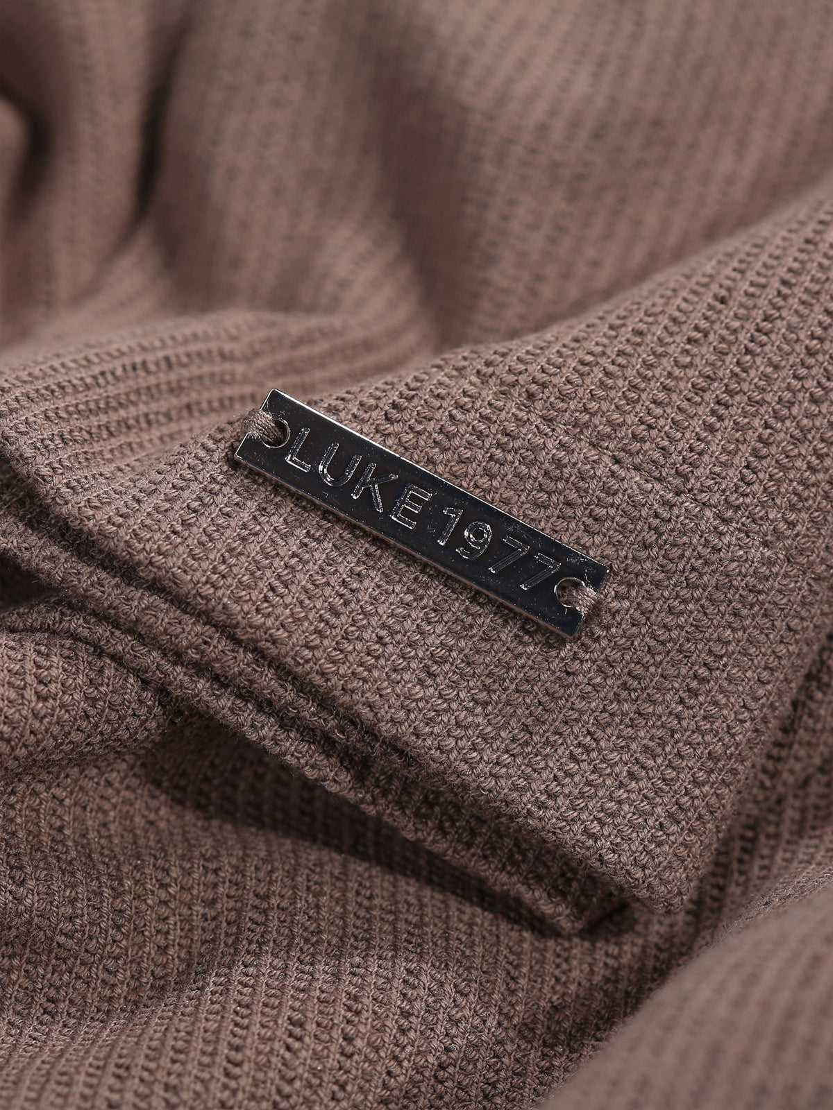 Men's brown shirt with button-up front.