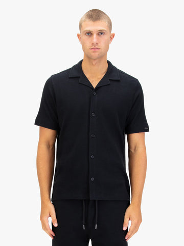 Men's black shirt with button-up front.