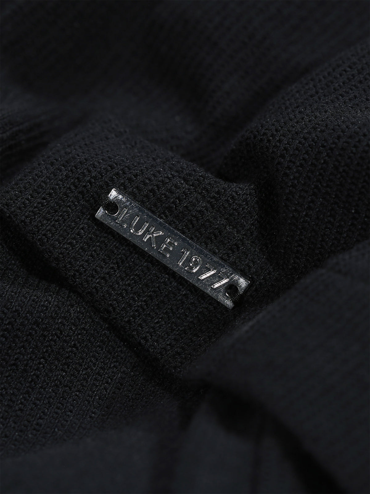 Men's black shirt with button-up front.