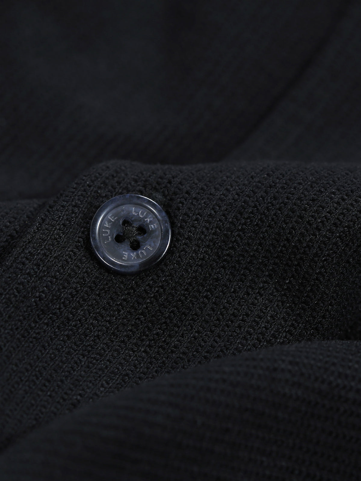 Men's black shirt with button-up front.