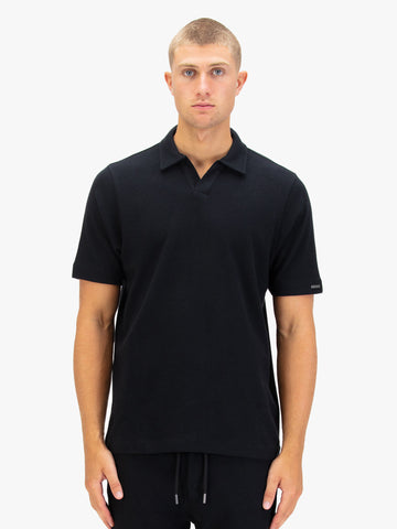 Men's black polo shirt with polo collar.