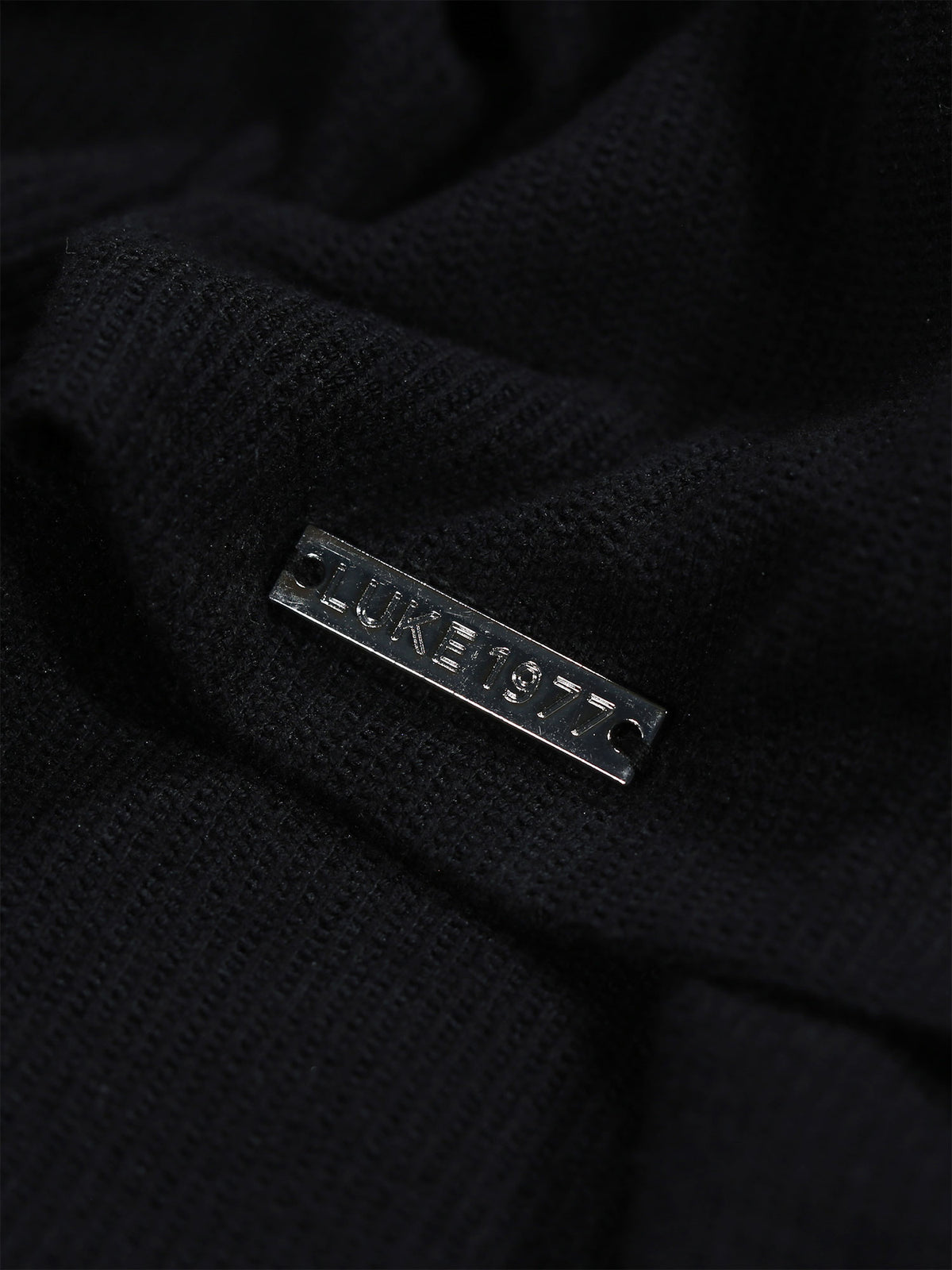 Men's black polo shirt with polo collar.