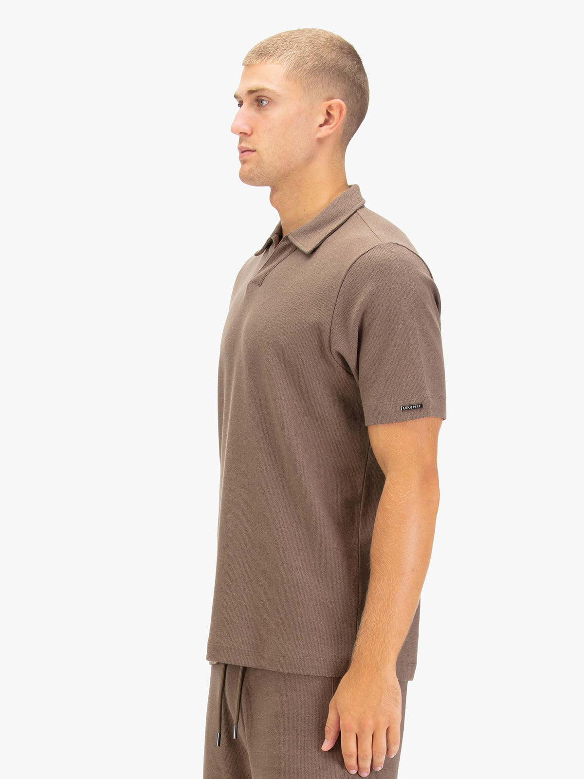 Men's brown polo shirt with polo collar.