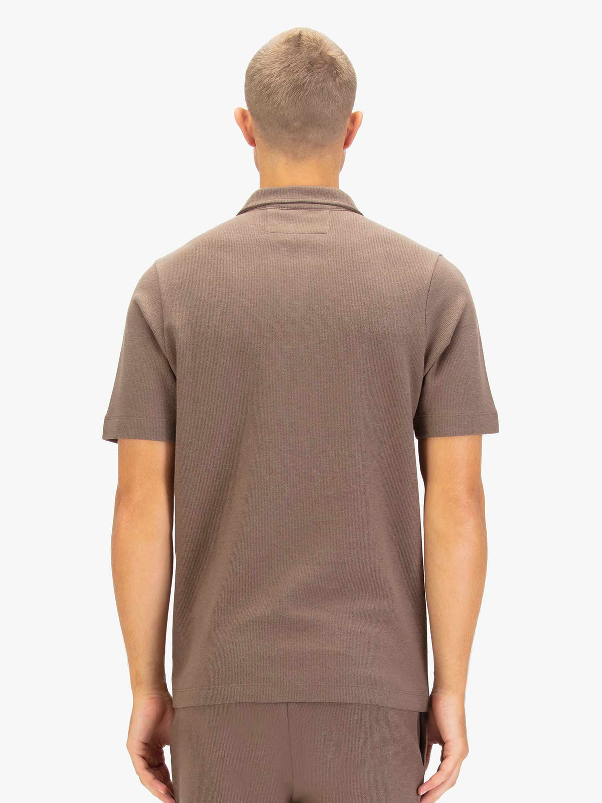 Men's brown polo shirt with polo collar.