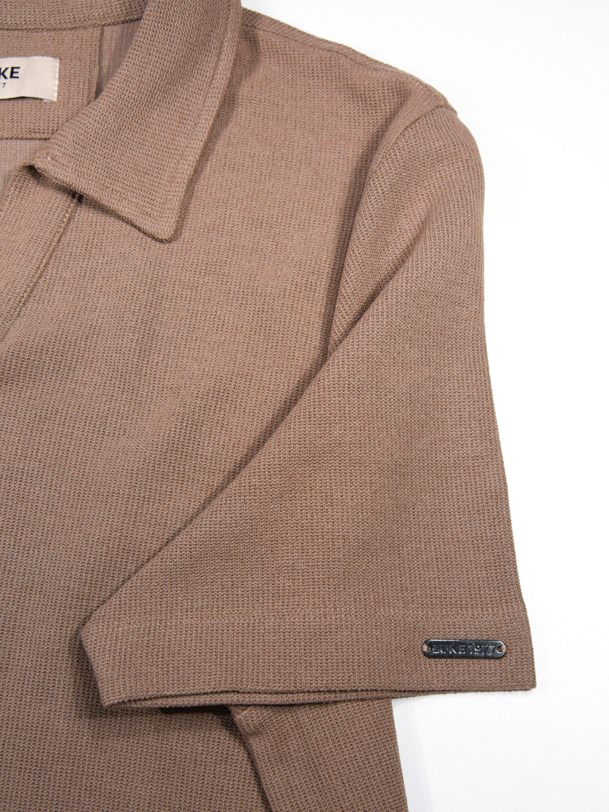 Men's brown polo shirt with polo collar.