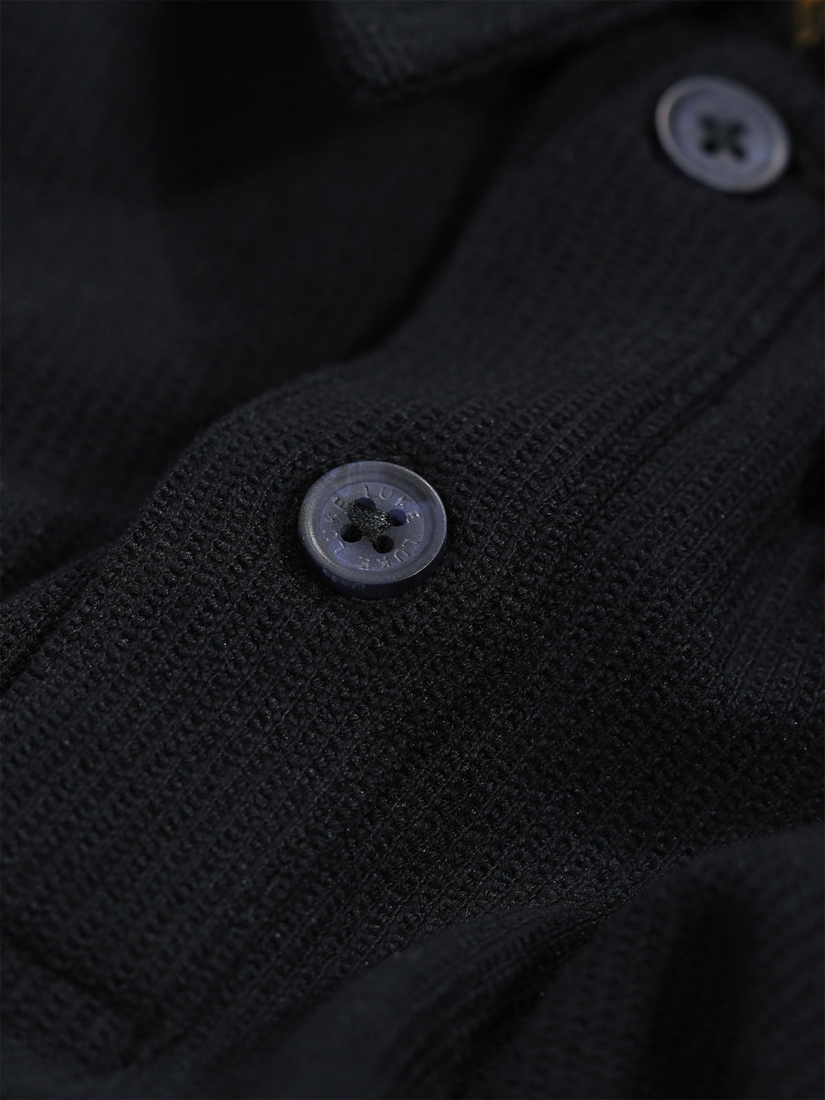 Men's black polo shirt with polo collar.