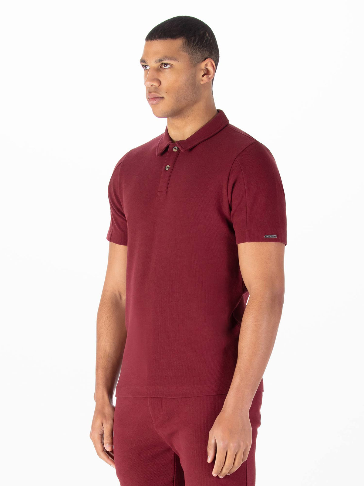 Men's red polo shirt with polo collar.