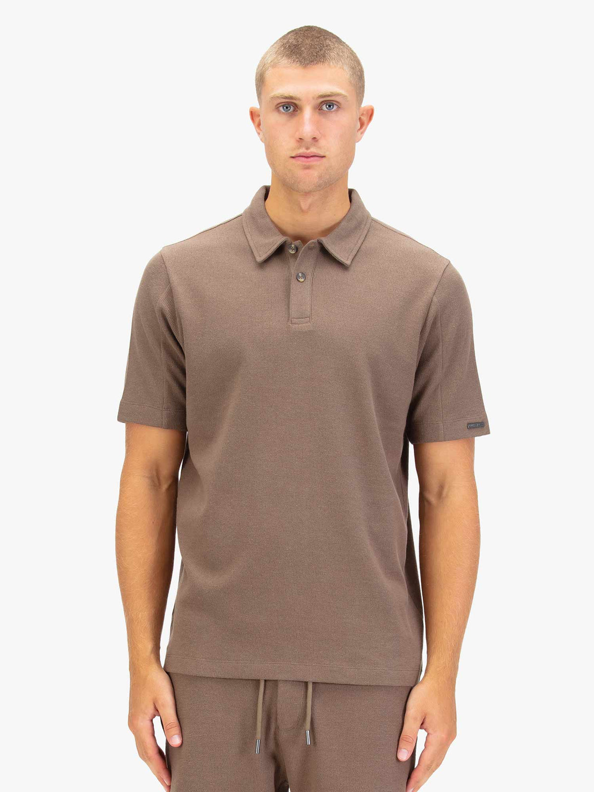Men's brown polo shirt with polo collar.