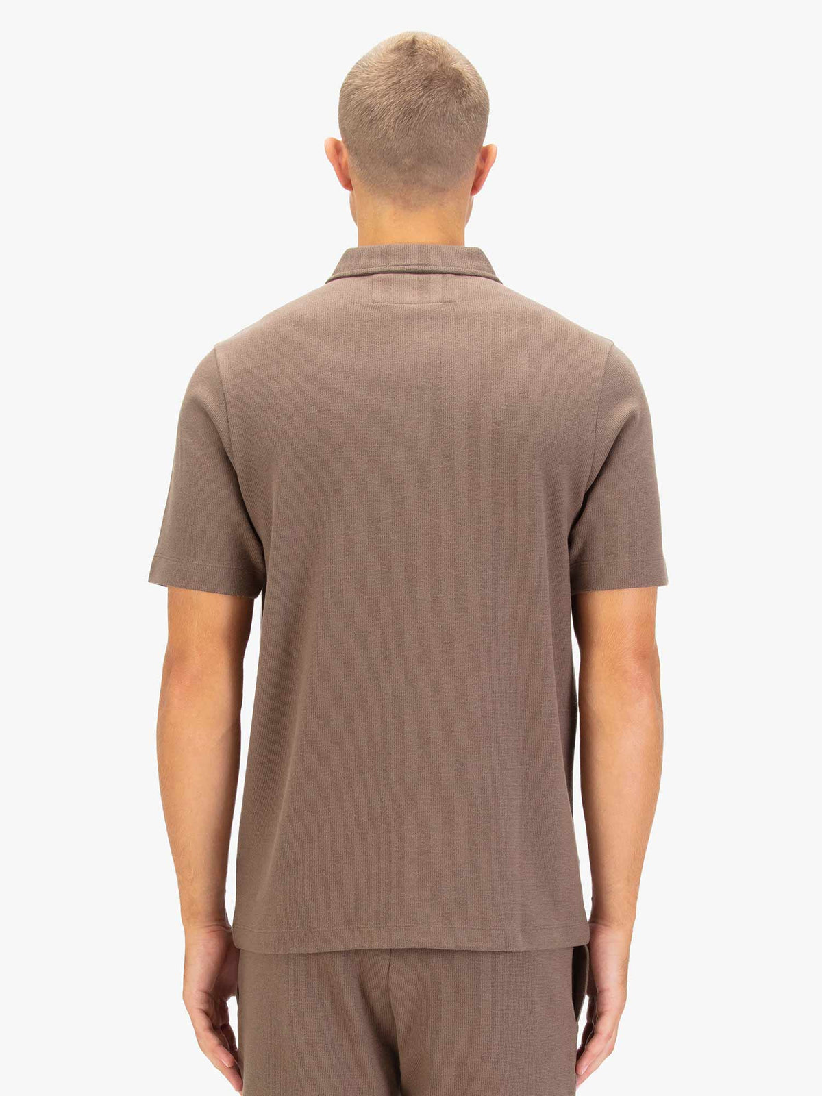 Men's brown polo shirt with polo collar.