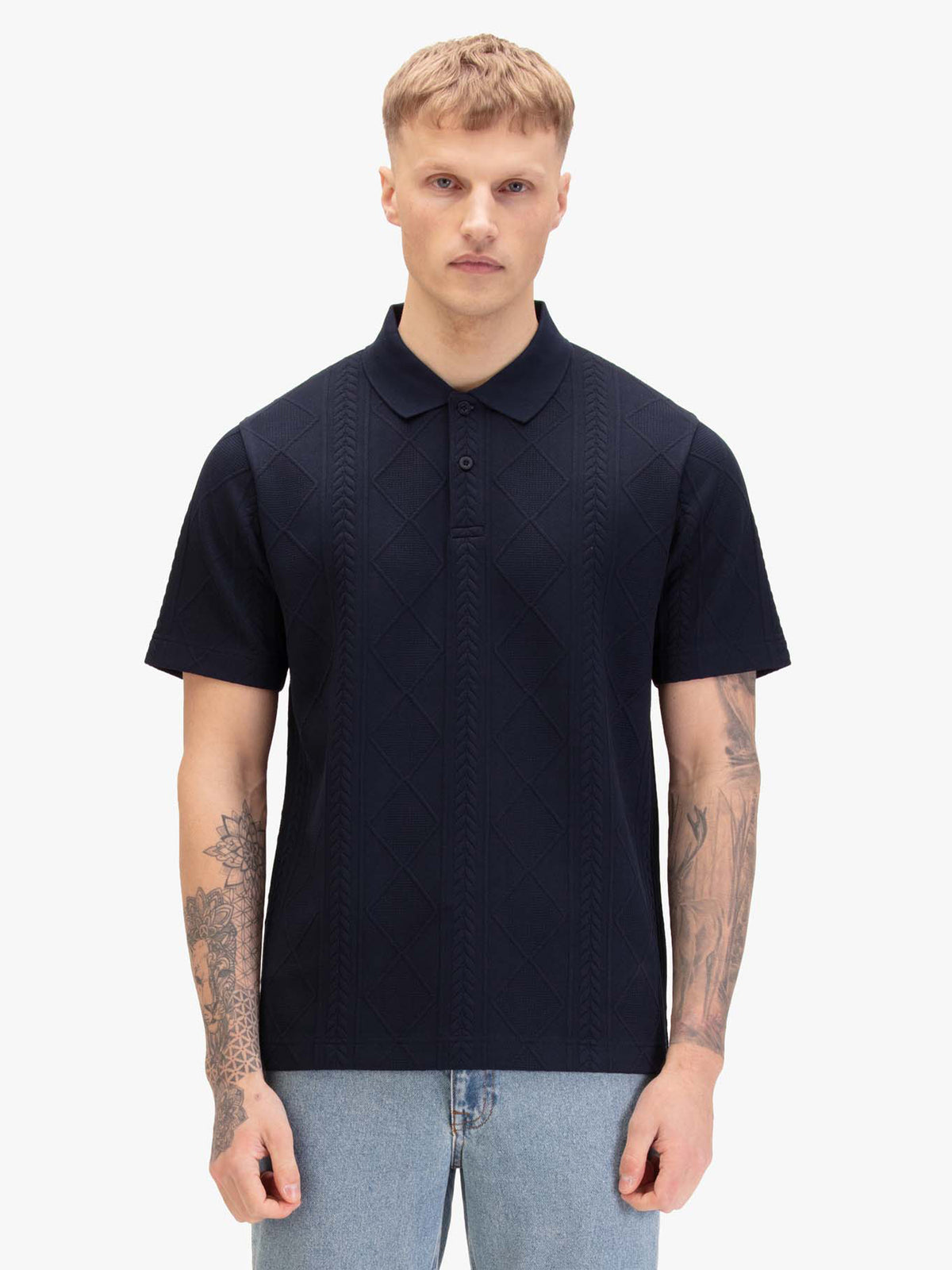 Men's navy polo shirt with polo collar, worn by a model, front view