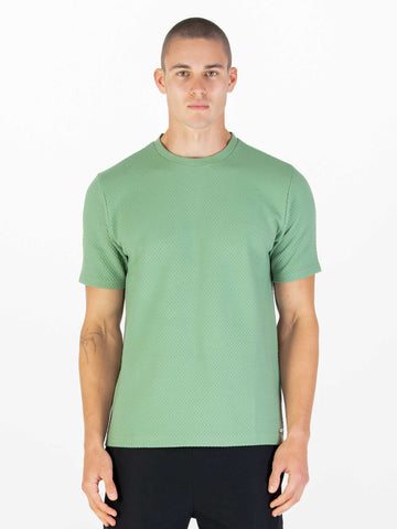 Men's green t-shirt with crew neck and short sleeves worn by a model - front view.