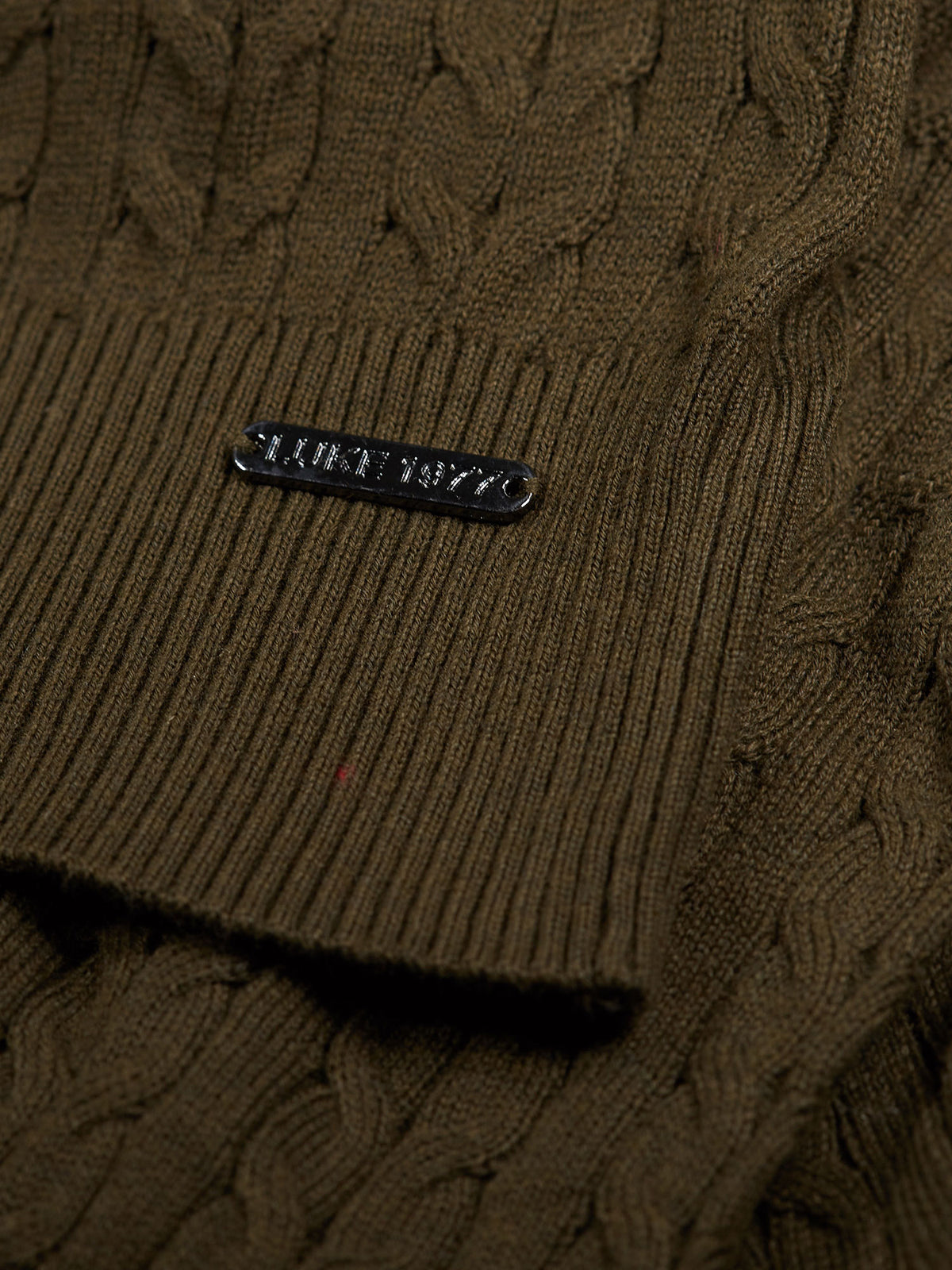 Men's green jumper.