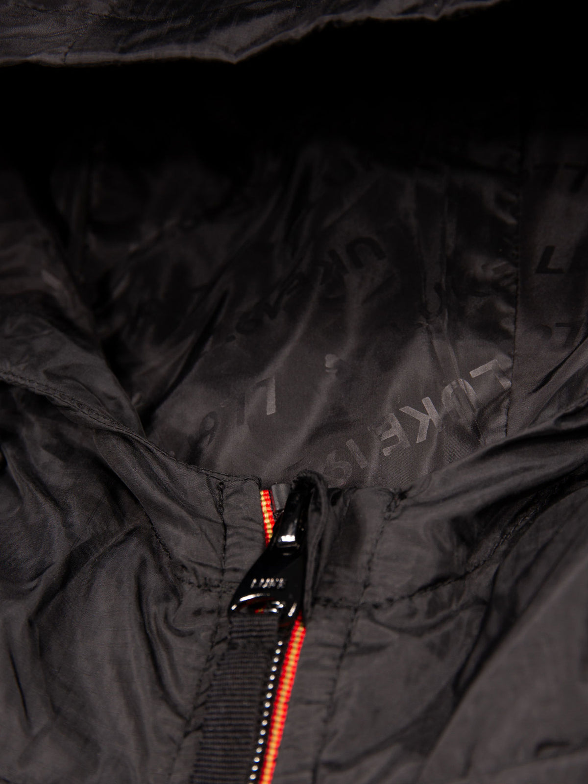 Men's black jacket with zip-up front.