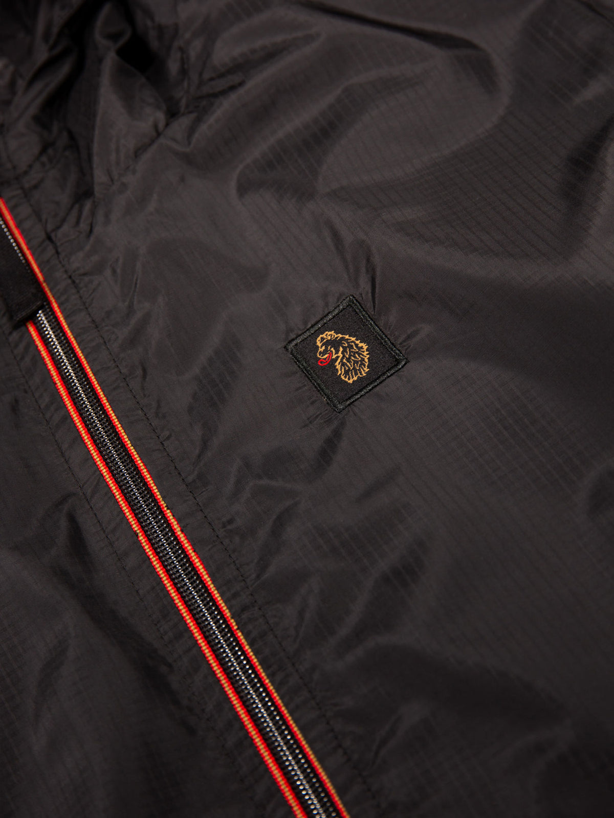 Men's black jacket with zip-up front.