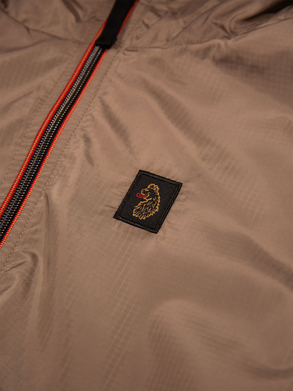 Men's brown jacket with zip-up front.