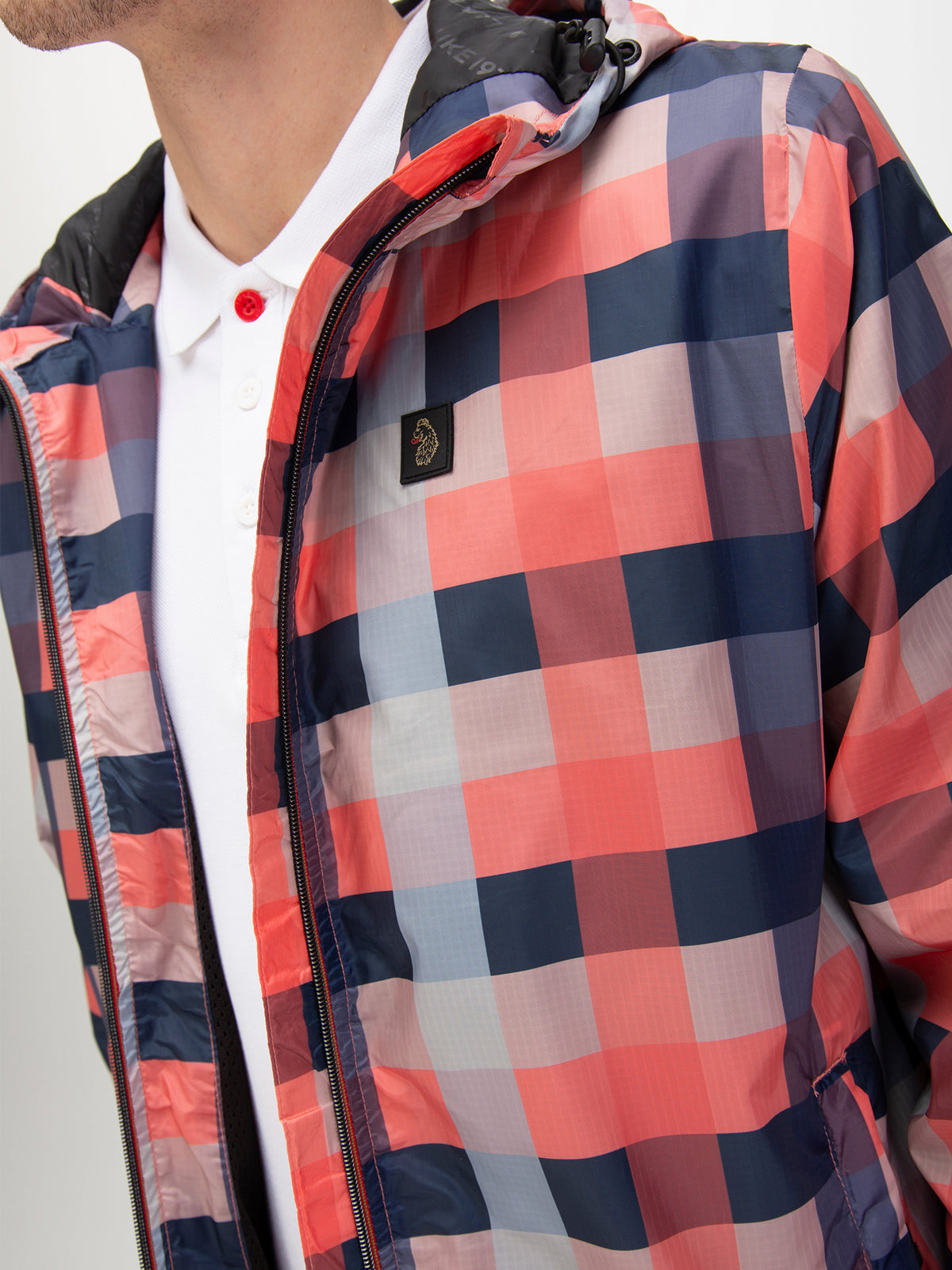 Men's orange jacket with zip-up front, worn by a model