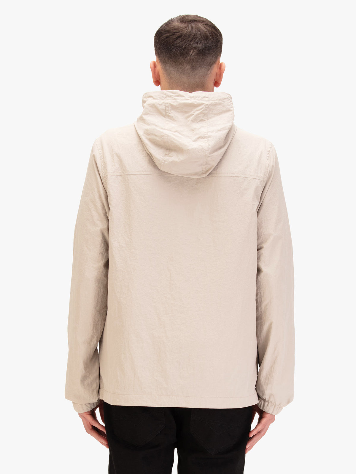 Men's beige jacket with chest pocket, worn by a model, back view