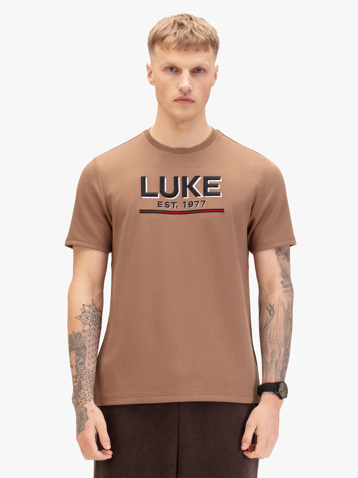 Men's brown t-shirt with crew neck and short sleeves worn by a model - front view.