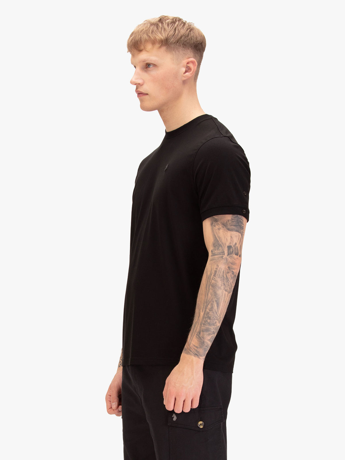 Side view of man wearing black LUKE 1977 Shanghai Modal t-shirt