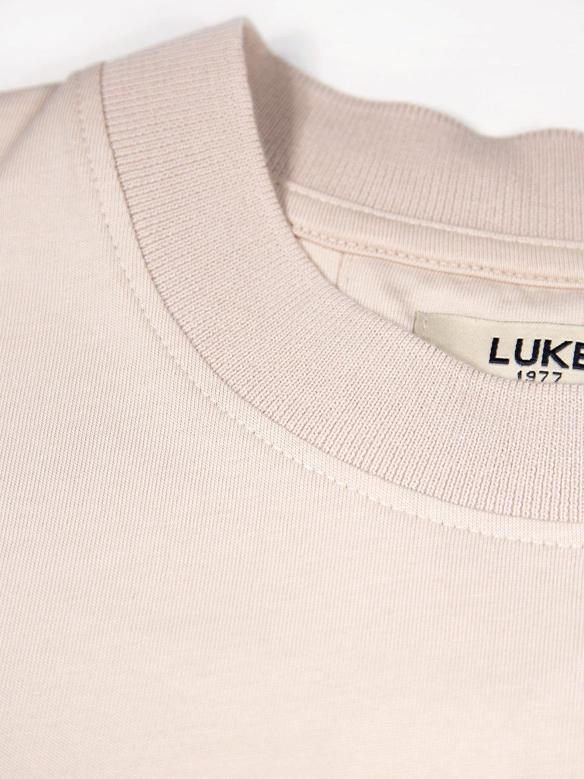 Men's beige t-shirt with crew neck and short sleeves.