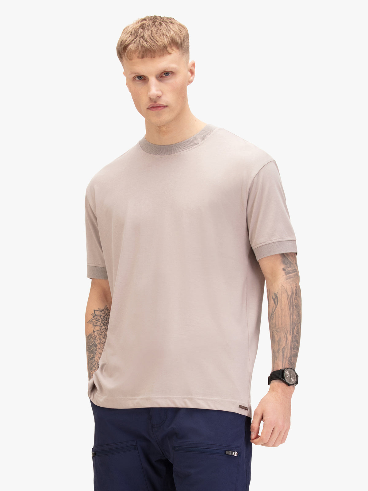 Men's grey t-shirt with crew neck and short sleeves worn by a model - front view.