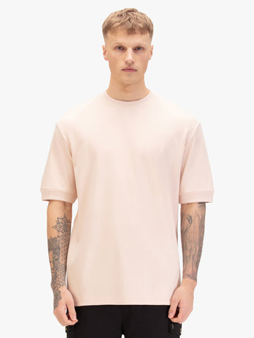 Men's relaxed-fit pink t-shirt with crew neck and short sleeves, front view