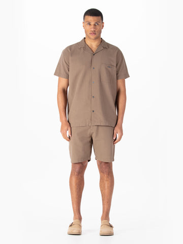 Men's brown short set with short-sleeve shirt and matching shorts.