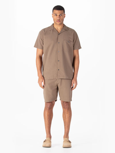 Men's brown short set with short-sleeve shirt and matching shorts.