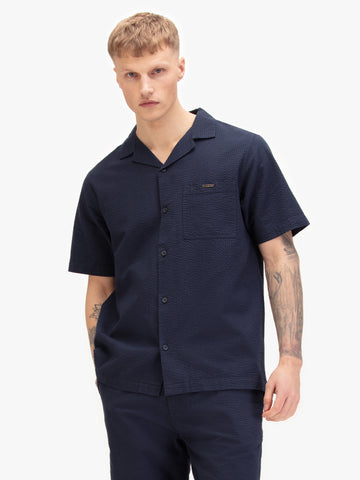 Men's navy shirt with button-up front, front view