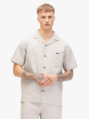 Men's grey shirt with button-up front, front view