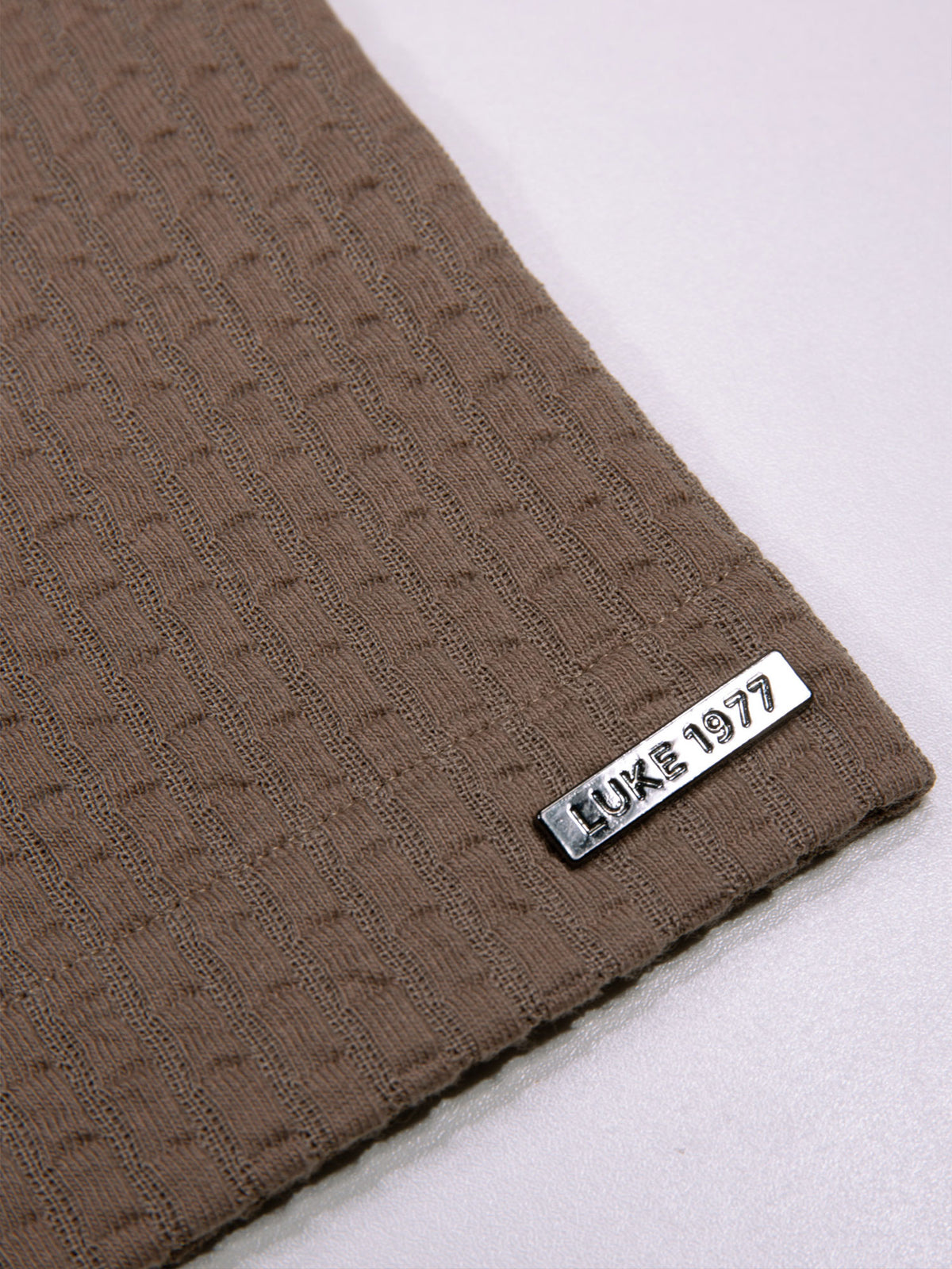Men's brown shirt with button-up front.