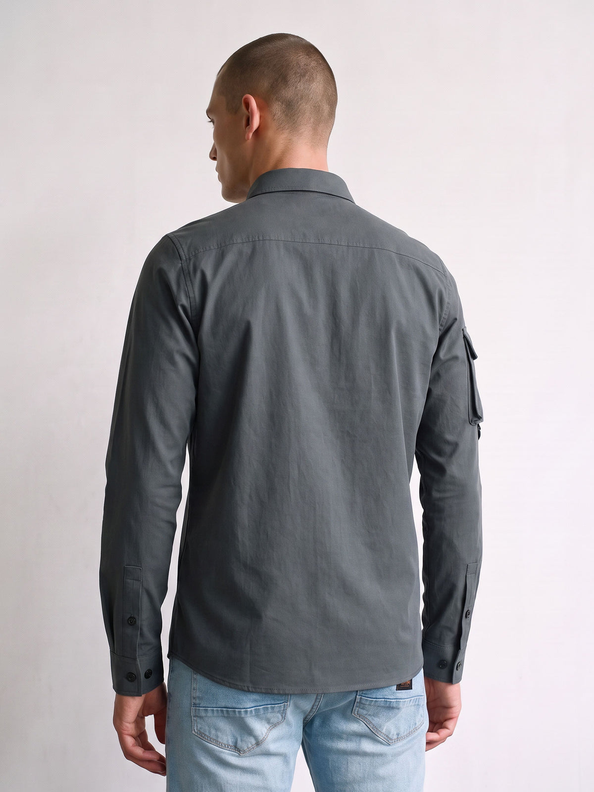 Back view of charcoal LUKE 1977 Hulun technical overshirt worn by model