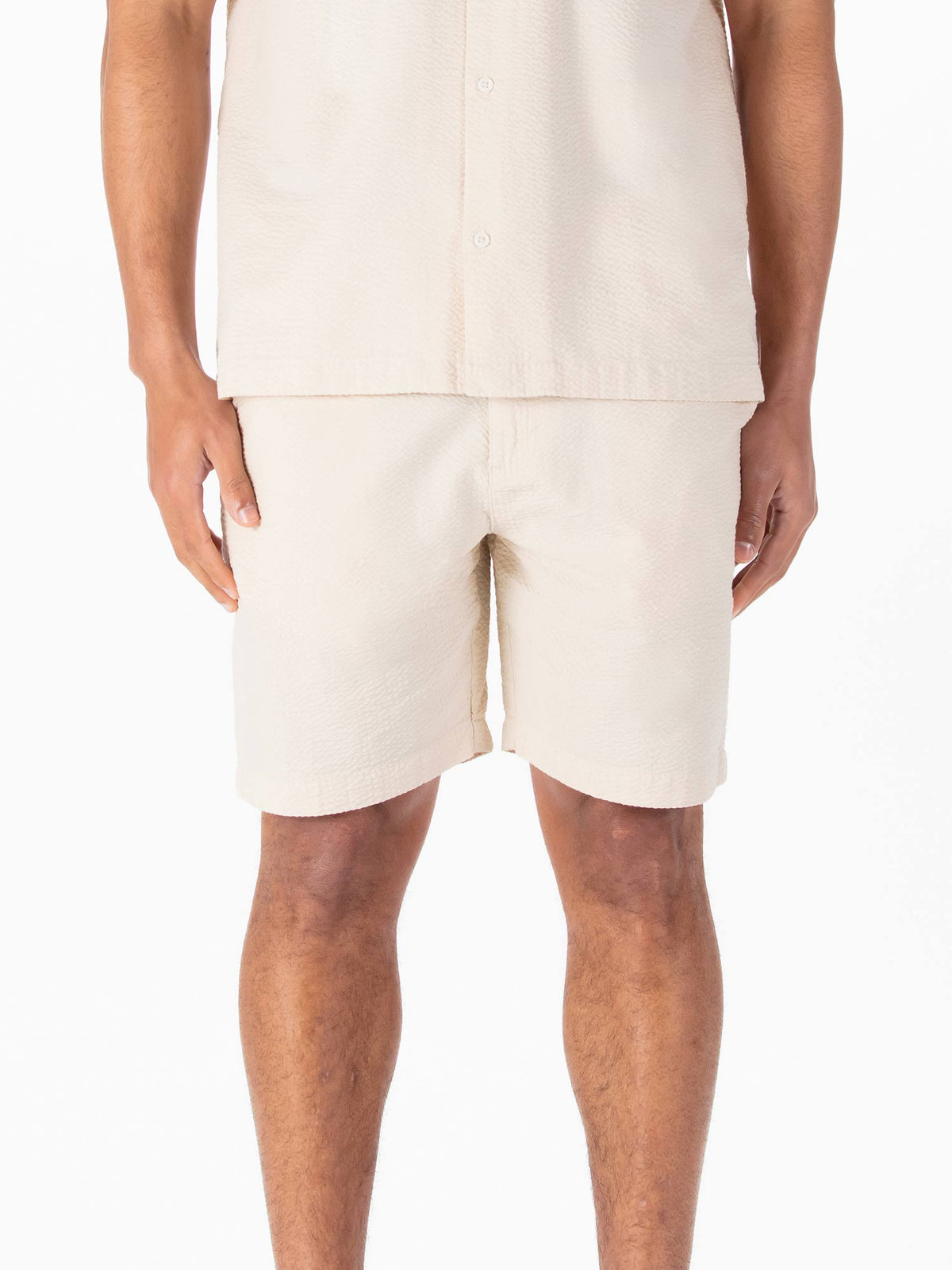 Men's beige shorts with drawstring waistband.