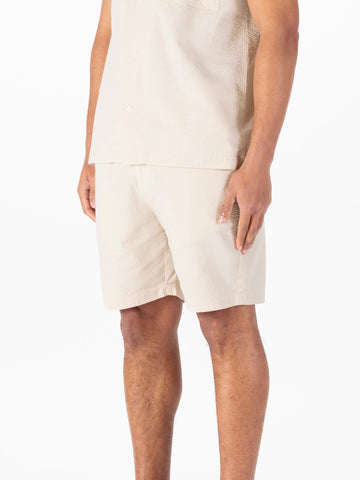 Men's beige shorts with drawstring waistband.