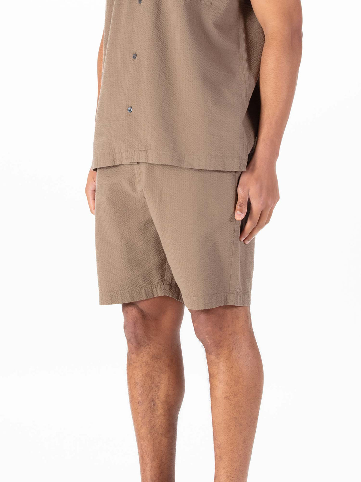 Men's brown shorts with drawstring waistband.