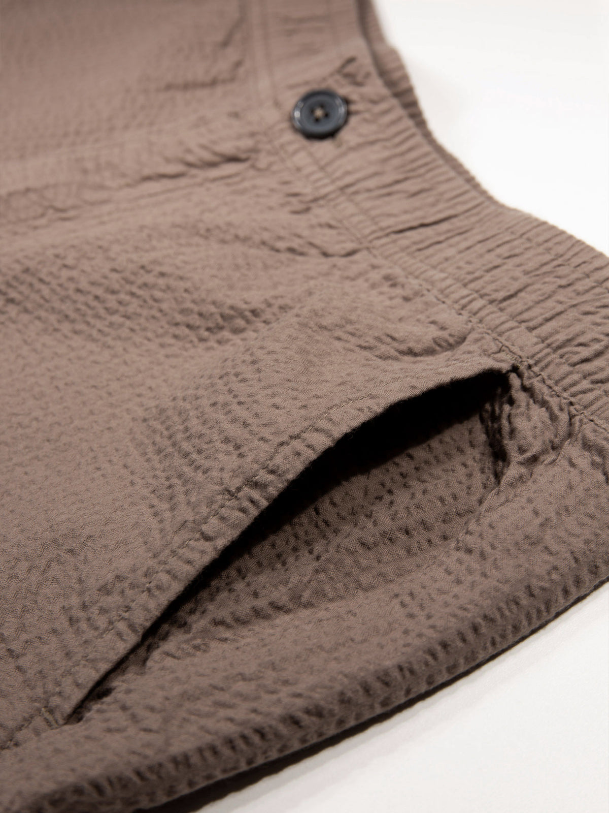 Men's brown shorts with drawstring waistband.