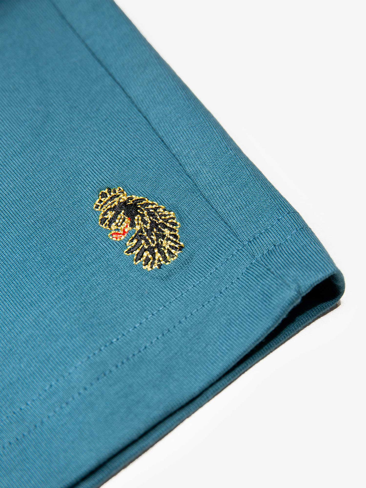 Men's blue short set with short-sleeve shirt and drawstring shorts, detail view.