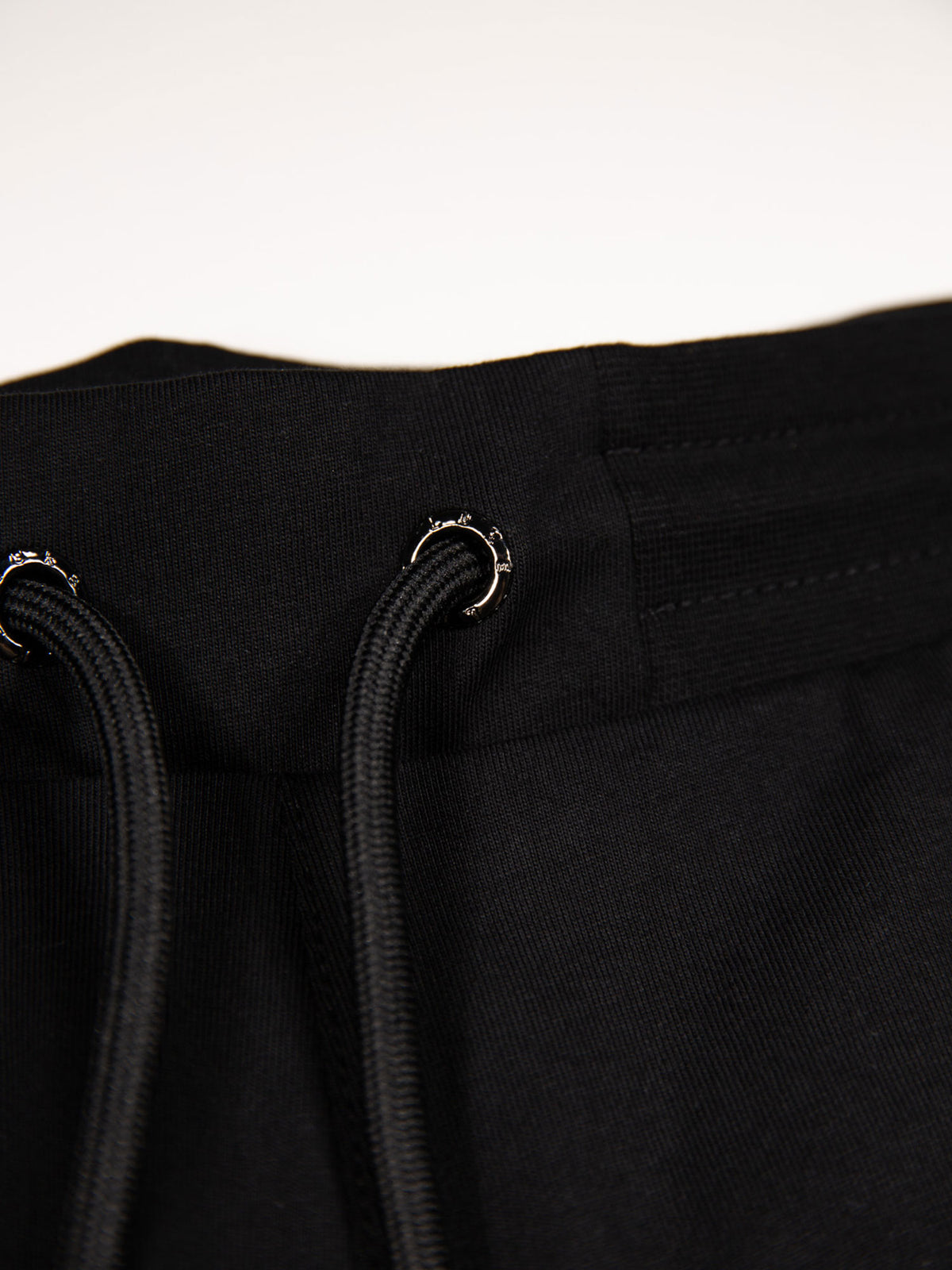 Men's black shorts with drawstring waistband, detail view 2